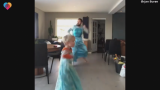 Father and son wear Elsa costumes, dance on Frozen song