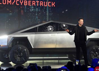 Tesla hits $100 billion in market cap