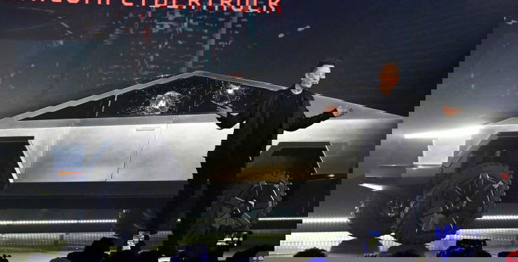 Tesla hits $100 billion in market cap