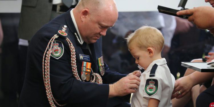 Firefighter’s posthumous medal presented to toddler son