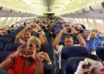 This photo of healthcare professionals flying to New York is all love!