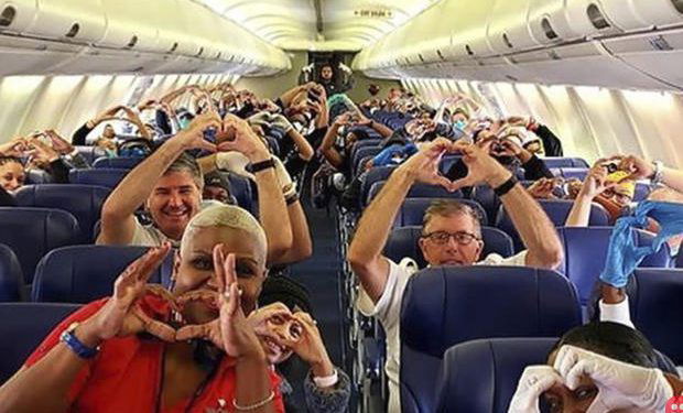This photo of healthcare professionals flying to New York is all love!