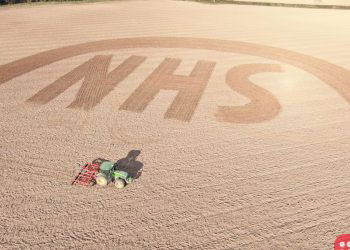Farmer pays tribute to healthcare workers by ploughing this sign in his field