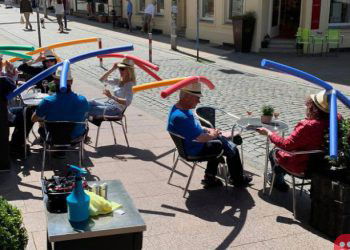 German cafe asks customers to wear pool-noodle hats to ensure social distancing