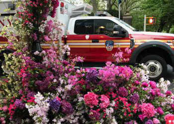 New York floral designer sets beautiful flower arrangements for healthcare workers