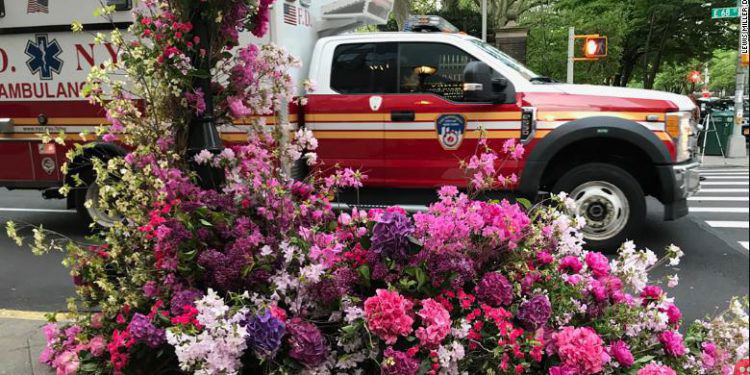 New York floral designer sets beautiful flower arrangements for healthcare workers