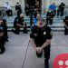 Many US police officers march and kneel with protesters to show solidarity