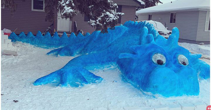 Canadian woman creates massive blue snow dragon in her driveway to spread cheer