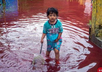 Indonesian Village Submerged By Red Water As Floods Hit Batik Factory
