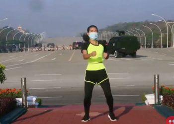 Watch this aerobics instructor doing her workout routine oblivious to the Myanmar coup that unfolded behind her